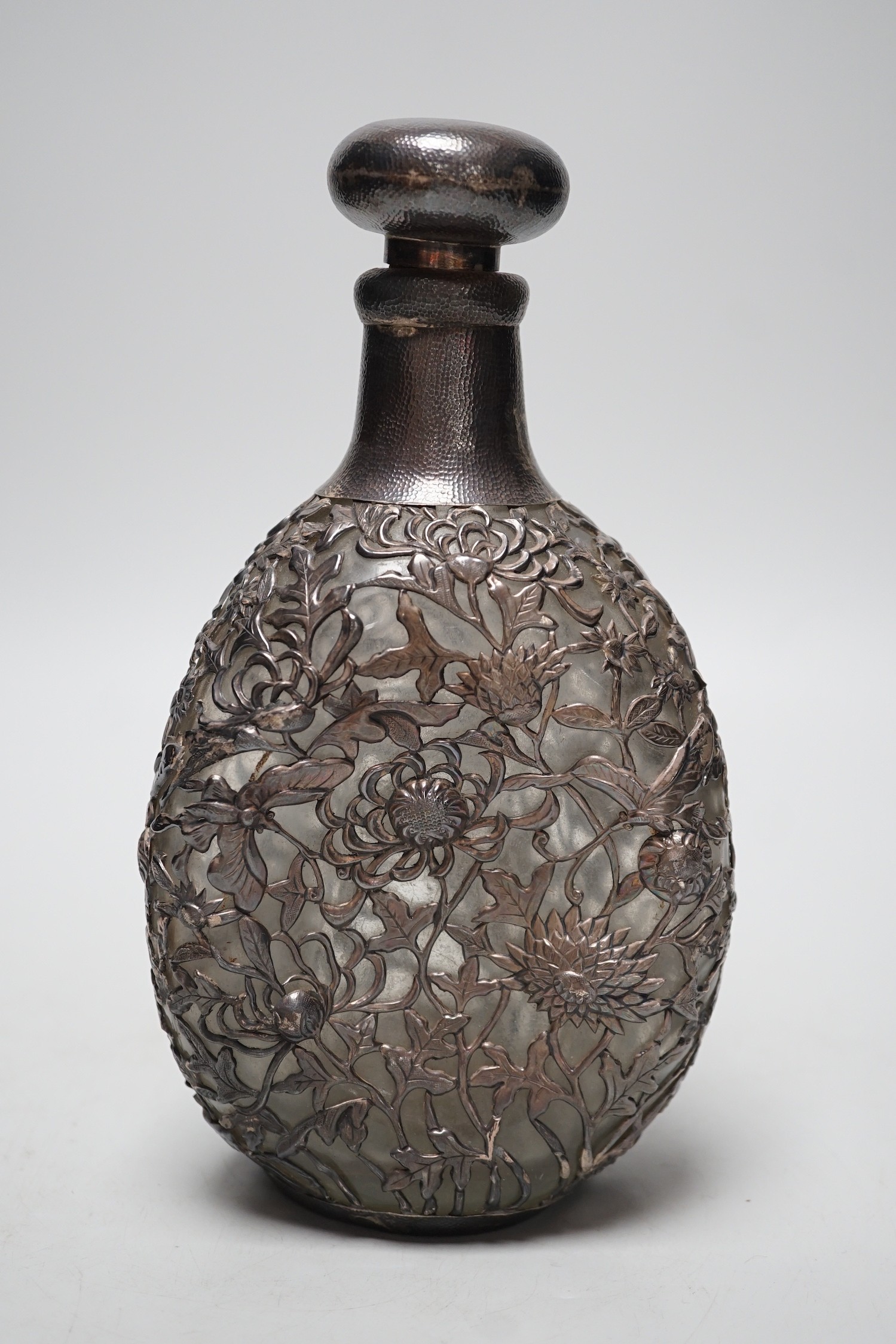A Chinese planished white metal mounted dimpled decanter and stopper, by Yeching, 23.5cm.
